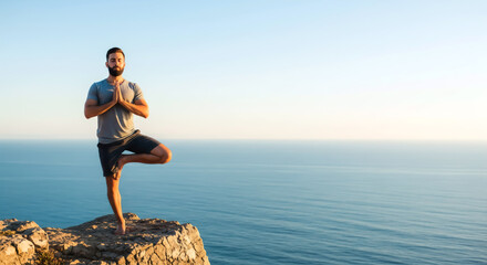 Man Practicing Yoga Balance Pose on Cliff Overlooking Ocean