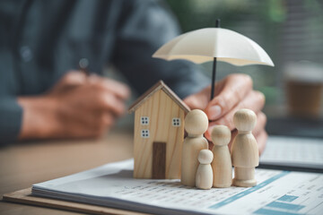 Home insurance and family protection concept showing a house and family figures under an umbrella, symbolizing property coverage, risk management, homeowner safety, and long-term financial security.