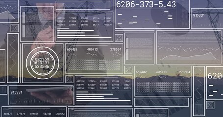 Animation of financial data processing over caucasian businessman using tablet - Powered by Adobe
