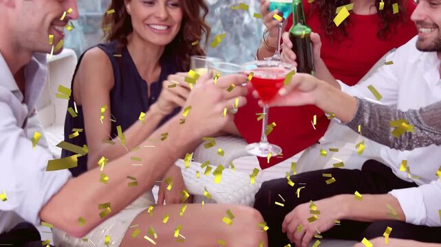 Five adults raising cocktails and tilting beer as gold confetti falling, celebrating pool events