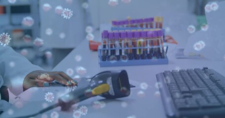 Animation of virus cells over african american female scientist in lab - Powered by Adobe