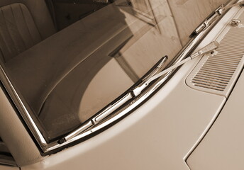 Vintage Car Windshield Detail Closeup. Angled View Beige Tones Classic