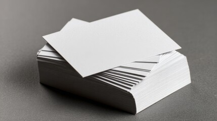 Two blank business cards on a neutral grey background for corporate branding, professional stationery presentation, and creative office identity design