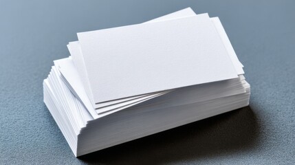 White blank business card held in hand with minimalist professional design on a clean background for creative branding, corporate stationery, and business presentation concepts