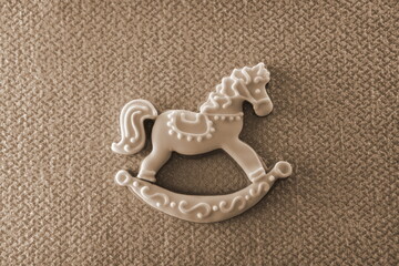 Rocking Horse Decorative Minimalist Top View. Beige White Toy Background
