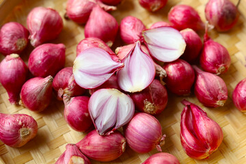 Red shallots on white background.