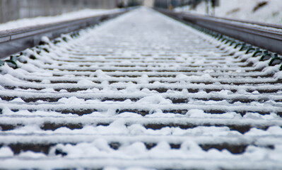 Railway tracks covered in snow during winter season