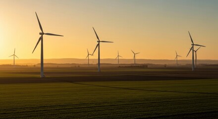 Wind turbines at sunset over a rural landscape
