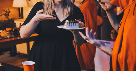 Friends enjoying a Halloween party at a bar making a toast
