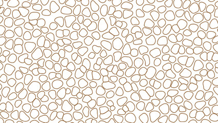 A blurry image of numerous small rounded objects in various shades of brown and beige