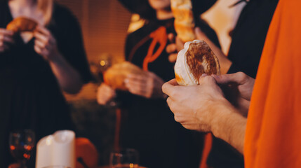 Friends enjoying a Halloween party at a bar making a toast
