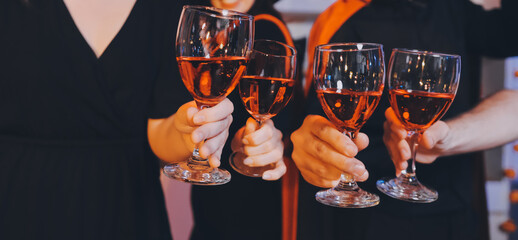 Friends enjoying a Halloween party at a bar making a toast