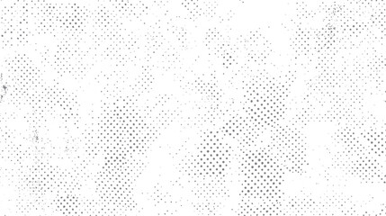 Abstract distressed background with a scattered pattern of grey halftone dots and subtle grunge textures on a white surface, providing a vintage or retro aesthetic for creative