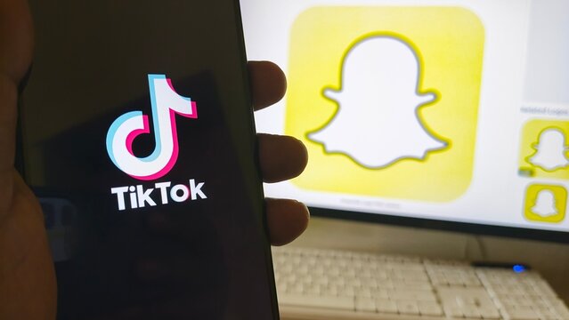 Social media apps on devices, TikTok and Snapchat logos