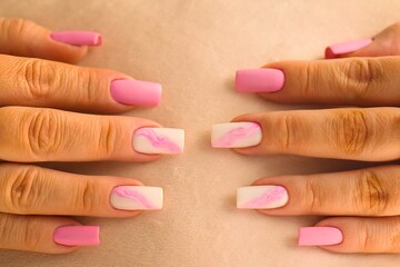 Chic feminine manicure styled with gold jewelry and soft knitwear.