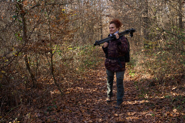 Naklejka premium Nature photographer hiking in forest