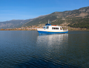 A pleasure tourist boat for tourists on Pamvotida Lake in Ioannina, Greece