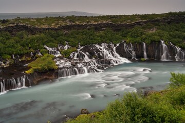 view of the picturesque Hraunfossar cascades in western Iceland