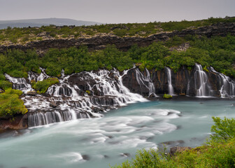 view of the picturesque Hraunfossar cascades in western Iceland
