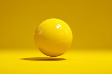 Vibrant yellow sphere on bright background with glossy reflective surface