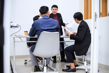 Team Of Professionals Engaged In Productive Meeting In Modern Office Setting
