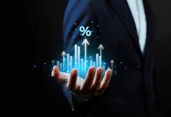 Businessman holding glowing financial growth chart with upward arrows and percentage symbol, representing interest rate increase, investment growth, profit, economic success, 