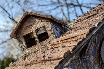 Old Wooden House Roof with Small Window Sunny Day