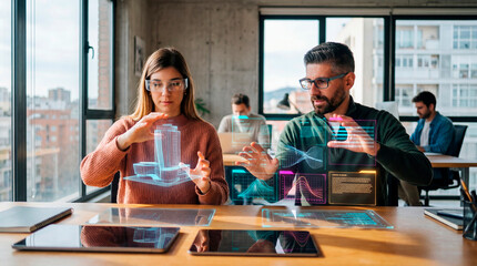 Two analysts manipulating holographic data panels and 3D building models at a shared desk
