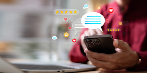 Man using mobile phone for customer satisfaction rating and service review.