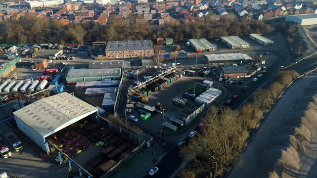 Top down aerial view of recycling centre, garbage disposal and rubbish tip, cars unloading refuse and waste in to skips, Rugby United Kingdom. 