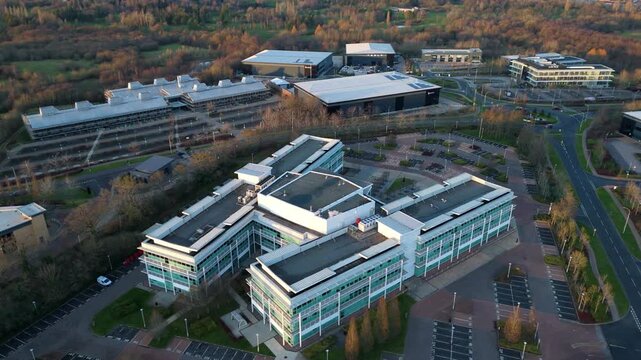 Aerial drone view of modern office buildings, glass and unique architecture at sunset in winter, Birmingham UK