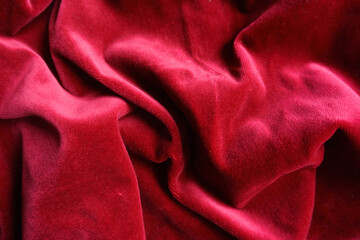 Creased deep red velour cotton fabric texture