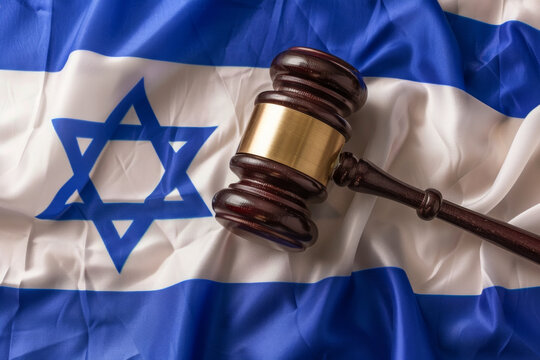 A judges gavel hammer with an Israel flag. law and order