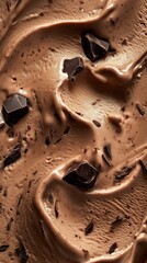 Creamy chocolate ice cream with dark chocolate chunks macro texture closeup.