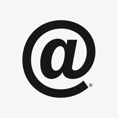 Black at symbol on a neutral background, representing digital communication and connection. Useful for topics related to technology, social media, and online interaction.