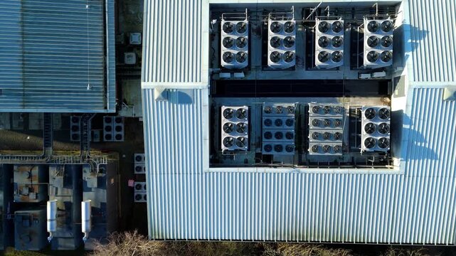 Top down aerial view of Critical data center infrastructure, HVAC fans and cooling units on roof for Quantum computing cloud storage IT services, futuristic server air cooled in Redditch, UK