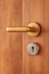 Obraz premium Modern golden door handle and silver keyhole on light brown wooden door, indoors, security concept