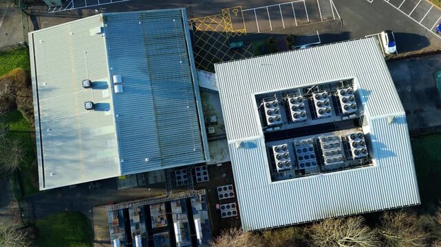 Top down aerial view of Critical data center infrastructure, HVAC fans and cooling units on roof for Quantum computing cloud storage IT services, futuristic server air cooled in Redditch, UK