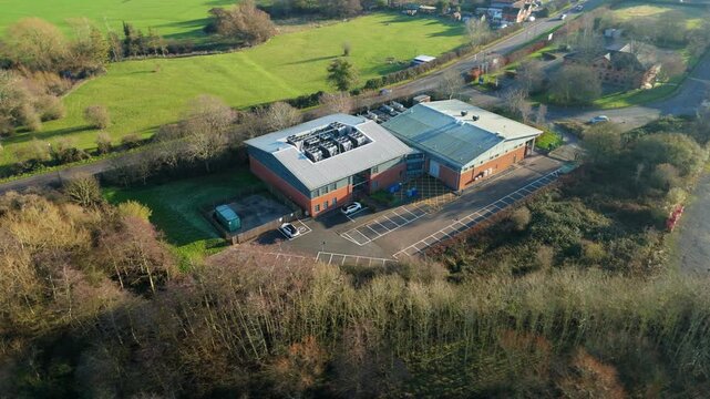 Aerial view of large state of the art data center, Quantum computing and IT services, cloud storage, critical futuristic infrastructure, cooling fans HVAC in Redditch, UK