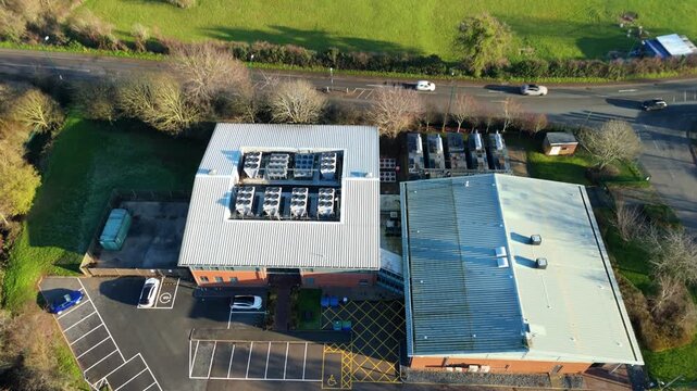 Aerial view of large state of the art data center, Quantum computing and IT services, cloud storage, critical futuristic infrastructure, cooling fans HVAC in Redditch, UK