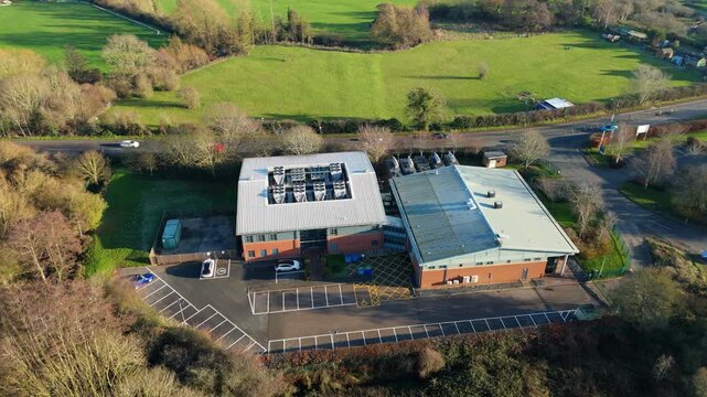 Aerial view of large state of the art data center, Quantum computing and IT services, cloud storage, critical futuristic infrastructure, cooling fans HVAC in Redditch, UK