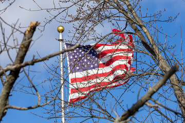 american flag against blue sky