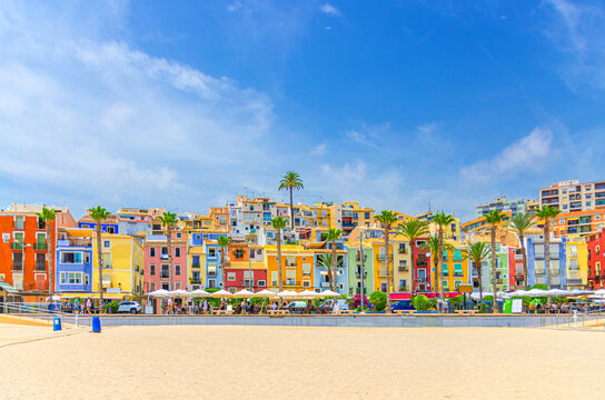 Villajoyosa old town embankment promenade, typical colorful houses traditional multicolored buildings Les Cases de Colors, Platja Centre Central Beach, La Vila Joiosa city, Alicante province, Spain