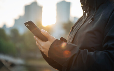 Woman using cellphone in city