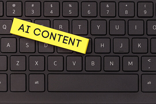 A sticky note on a black laptop keyboard reads "AI CONTENT." This simple image highlights the increasing role of artificial intelligence in content creation.