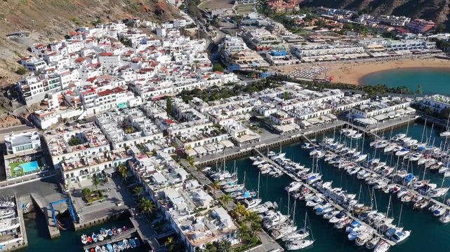 Puerto de Mog&aacute;n Marina and Little Venice White Village, Gran Canaria, Canary Islands - 4K Cinematic Aerial