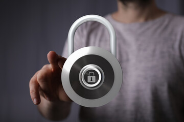 Person interacting with a virtual security lock icon, concept of data protection and privacy in a digital world