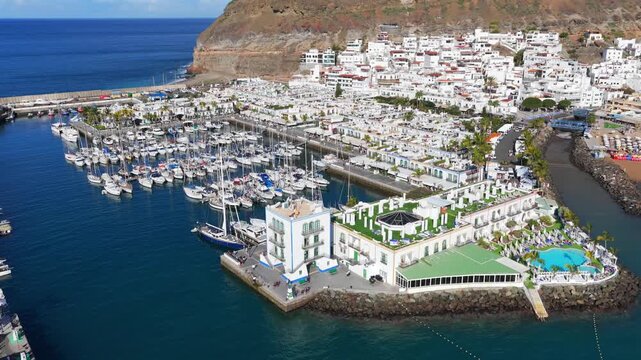 Puerto de Mog&aacute;n Marina and Little Venice White Village, Gran Canaria, Canary Islands - 4K Cinematic Aerial