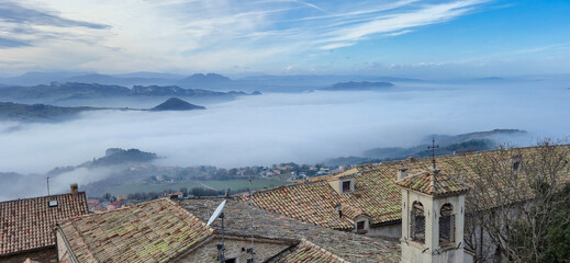 Mystical panorama from the Republic of San Marino with fog and clouds