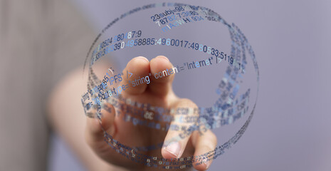 A hand interacting with a digital data sphere, representing technology, internet, and modern innovation. Ideal for concepts like conn